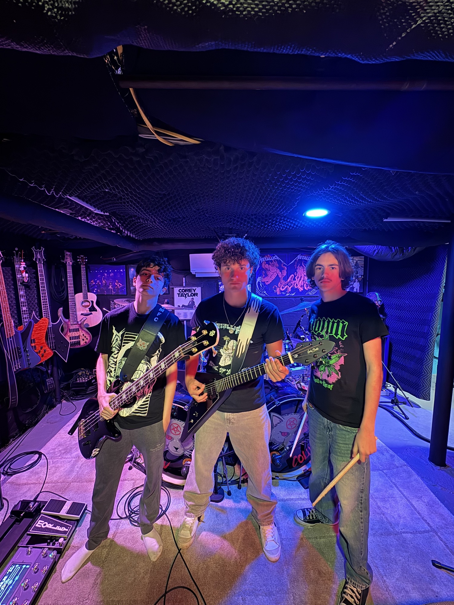 The three members of Kiloton with their instruments in the rehearsal studio